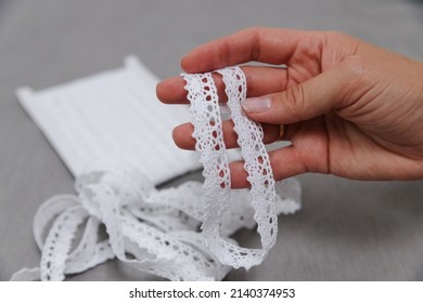 In The Hands Of Pulling A Sewing Ribbon