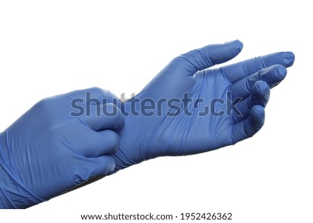 Hands putting on medical gloves, isolated on white background