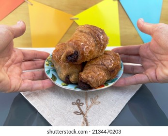 Hands Putting Plate Of Croissants On Birthday Table Closeup