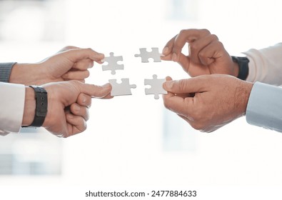 Hands, puzzle and teamwork for solution in office with business people, support and connection. Group, scrum or huddle with jigsaw, synergy and strategy for problem solving with link in workplace