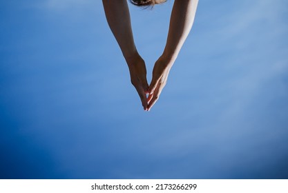 Hands Reach For The Sky, A Triangle Of Human Hands, Body Parts, Blue Sky, Minimalism In Life. High Quality Photo