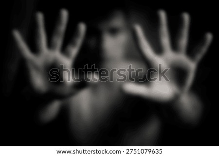 The Hands Reaching Forward in Dramatic Black and White Portrait with Blurred Face