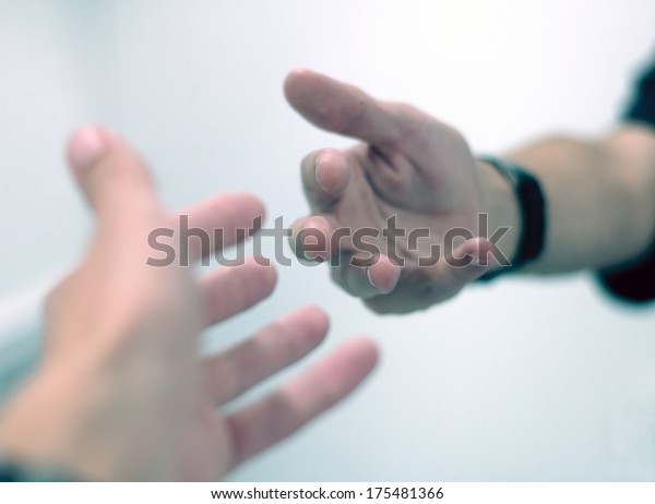 Hands Reaching Out Each Other Stock Photo (Edit Now) 175481366