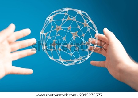 Hands Reaching Towards Abstract Network Sphere Concept