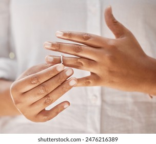 Hands, removing and wedding ring in divorce, ending or decision with spouse for conflict or problem. Person, separation and change in relationship status for marriage mistake, grief or break up