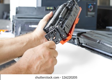 Hands Repairing Laser Toner Cartridge