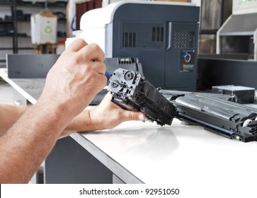 Hands Repairing Laser Toner Cartridge