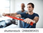 Hands, resistance band for strength training and man with physiotherapist in office for stretching. Exercise, fitness and healthcare professional with physiotherapy patient in rehabilitation clinic