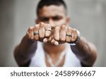 Hands, ring and man with fashion, jewellery and gangster with style, accessories and fist. Person, hand gesture and guy with trendy outfit, wearable and elegant with confidence, silver and luxury