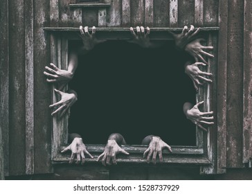 Hands rising out from the old window ancient house, Halloween concept. - Shutterstock ID 1528737929