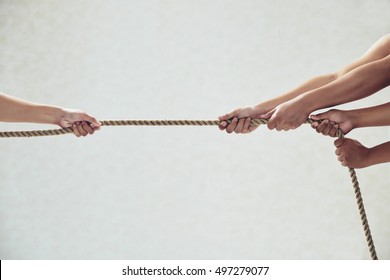 Hands Of Rivals Pulling Tug Of War