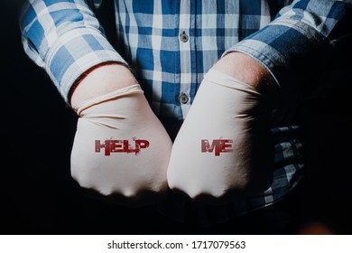 Hands with rubber gloves with text help me