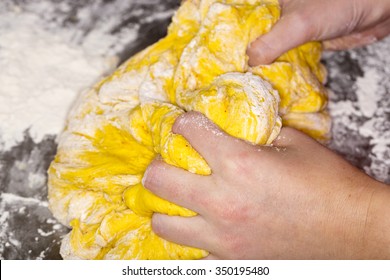 Hands In Saffron Bun Dough