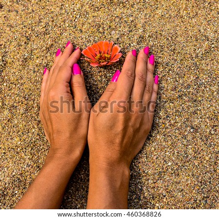 Hands in the sand