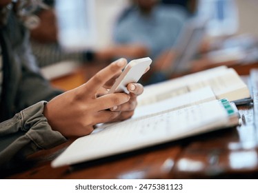 Hands, school and university with phone for research, reading message on mobile app in classroom. Student, college or social media with education or learning, scroll for news story with technology - Powered by Shutterstock