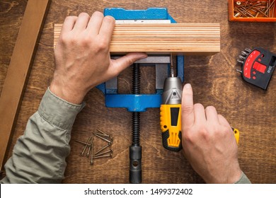 Hands screwing wooden boards. Woodwork, DIY, make or repair concept. - Shutterstock ID 1499372402