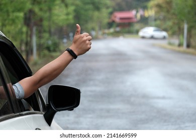 Hands Sending Help Symbols While Driving