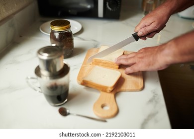 Hands Of Senior Man Making Coffee And Sandwiches For Breakfast