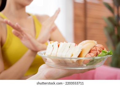 Hands Serving Food And Young Caucasian Woman Making Sign Say No Food Unhealthy With Obese, Woman Refuse And Push Out Food With Temptation For Dieting, Nutrition And Fast Food A Bad, Health Concepts.