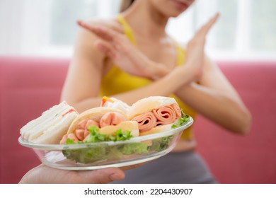 Hands Serving Food And Young Caucasian Woman Making Sign Say No Food Unhealthy With Obese, Woman Refuse And Push Out Food With Temptation For Dieting, Nutrition And Fast Food A Bad, Health Concepts.