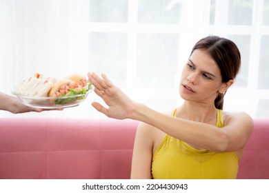 Hands Serving Food And Young Caucasian Woman Making Sign Say No Food Unhealthy With Obese, Woman Refuse And Push Out Food With Temptation For Dieting, Nutrition And Fast Food A Bad, Health Concepts.