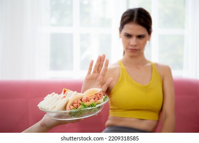 Hands Serving Food And Young Caucasian Woman Making Sign Say No Food Unhealthy With Obese, Woman Refuse And Push Out Food With Temptation For Dieting, Nutrition And Fast Food A Bad, Health Concepts.