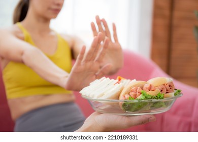 Hands Serving Food And Young Caucasian Woman Making Sign Say No Food Unhealthy With Obese, Woman Refuse And Push Out Food With Temptation For Dieting, Nutrition And Fast Food A Bad, Health Concepts.