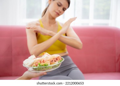 Hands Serving Food And Young Caucasian Woman Making Sign Say No Food Unhealthy With Obese, Woman Refuse And Push Out Food With Temptation For Dieting, Nutrition And Fast Food A Bad, Health Concepts.