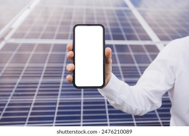 Hands showing blank screen mobile phone by pointing finger in front of solar panel - concept of application promotion, booking service and advertisement showing with copy space. - Powered by Shutterstock