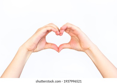 Hands Showing A Heart Shape Isolated On A White Background. Love And Harmony