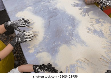 Hands Sifting Flour During Interactive Baking Workshop and Homemade Bread Making Class