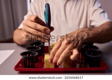 Hands Skillfully Managing Hydroponic Growing Medium with Exact Precise Careful Techniques