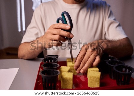 Hands Skillfully Managing Hydroponic Growing Medium with Exact Precise Careful Techniques