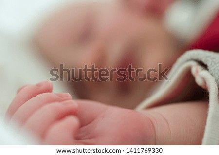 Similar – Baby sleeping on a blanket