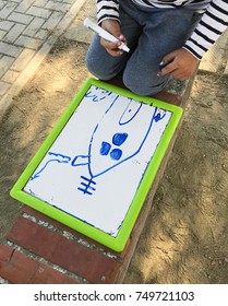 Hands small student drawing whiteboards in outdoors 