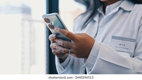 Hands, smartphone and woman doctor in hospital or online consulting, telehealth or wellness on information technology. Person, healthcare medicine or nurse on internet, clinic research and career - Powered by Shutterstock