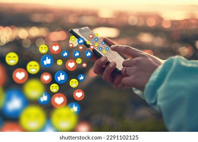 Hands, social media icon or girl with phone for communication, text chat or online dating. City sunset, emoticons overlay or woman on mobile app or digital network with love, like or heart emoji - Powered by Shutterstock