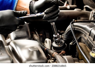 Hands With Socket Wrench Ratchet. Changing Car Oil Filter. DIY Change Engine Motor Oil. At Home Vehicle Maintenance. Filter Replacement. Oil Filter Cap