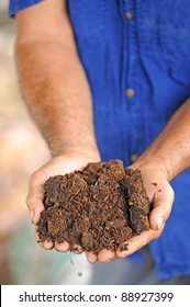 hands with soil