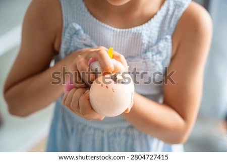 Hands squeeze a soft squishy stress relief toy during sensory play. Tactile interaction promotes relaxation, emotional regulation and stress reduction