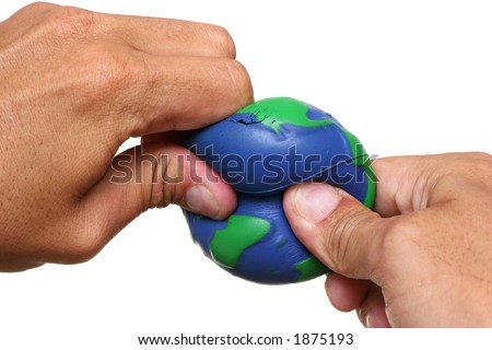 Hands squeezing Earth over a white background