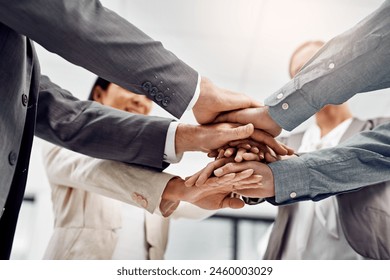Hands, stack and group of business people in office for team building, motivation and solidarity. Attorney, lawyer or advocate in low angle for staff with support in corporate law firm for goals