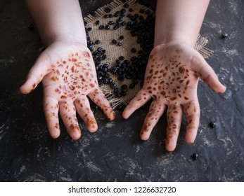 hands stained with coffee beans
