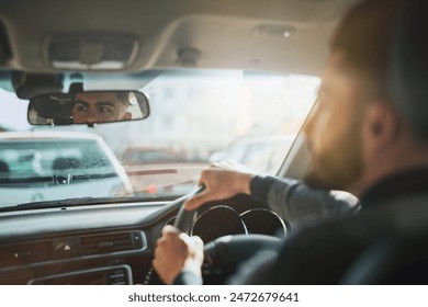 Hands, steering wheel and man in a car for road trip, transport and traffic jam navigation in a city. Travel, chauffeur and taxi driver in vehicle for cab, service and commute on highway journey - Powered by Shutterstock