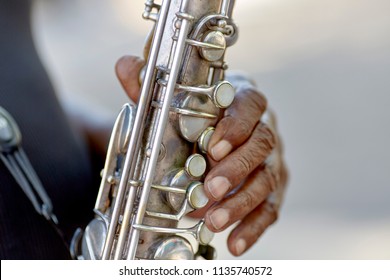 Hands Of A Street Muscian Playing A Saxaphone With Shallow Depth Of Field