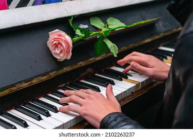 The Hands Of A Street Musician Playing The Piano