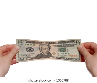 Hands Stretching $20 Bill on White Background