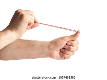 Hands stretching a rubber band as to shoot it, isolated on a white background. Red rubber band in hand. Elastic bands on hands.  dragging an elastic with hands.  - Powered by Shutterstock