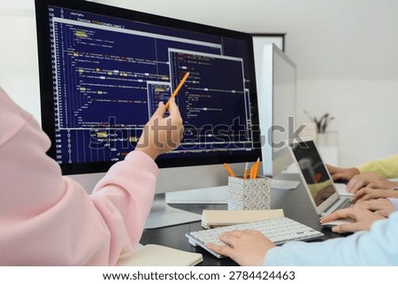 Hands of students studying at school computer lab, closeup