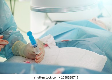 The hands of a surgeon.